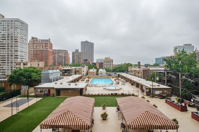 655 West Irving Park Road, Unit 2911 Chicago, IL 60613 - Photo 9 of 42 a view of a city with furniture and garden