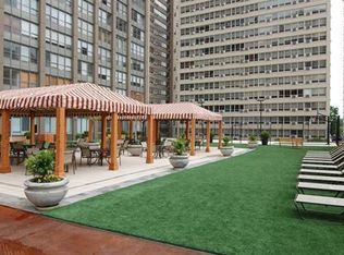 655 West Irving Park Road, Unit 2911 Chicago, IL 60613 - Photo 10 of 42 a view of a building with garden and sitting area