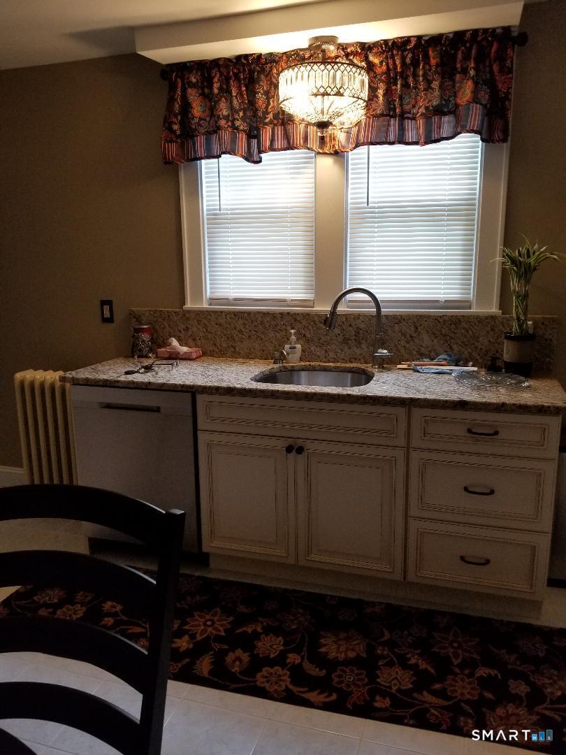 103 Windsor Street Enfield, CT 06082 - Photo 9 of 22 a kitchen with a sink and cabinets