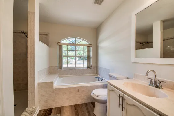 a bathroom with a sink toilet and a bathtub