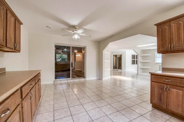 a view of a kitchen with microwave and cabinets
