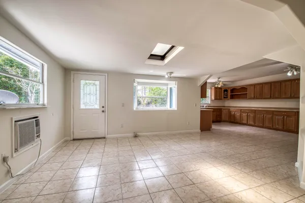 a view of an empty room with a window