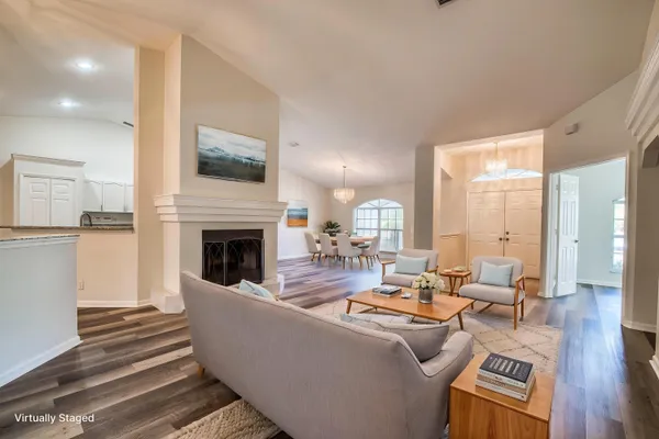 a living room with furniture and a fireplace