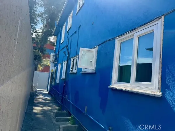 a kitchen with stainless steel appliances a refrigerator sink and stove
