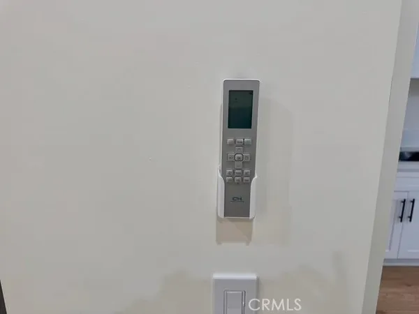 a view of a balcony with two chairs and a table