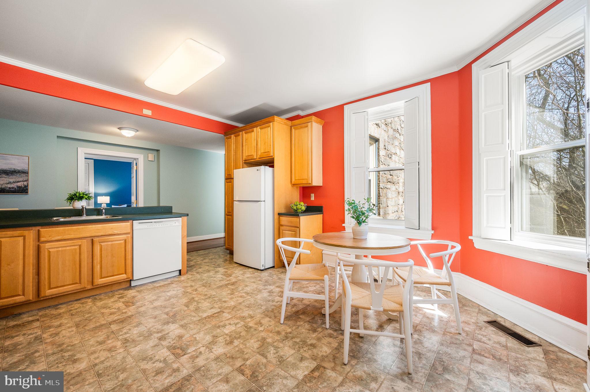 519 Walnut Lane, Unit 1 Swarthmore, PA 19081 - Photo 11 of 31 a dining room with a stove top oven table and chairs