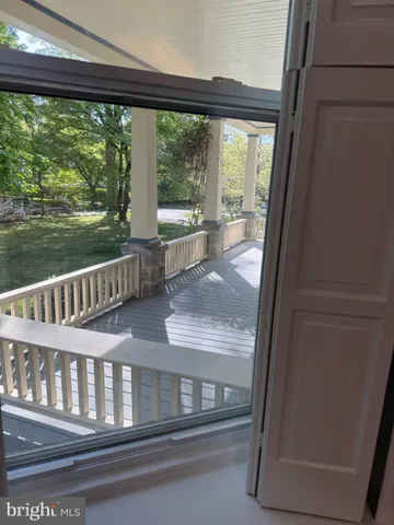 a view of porch with a small yard