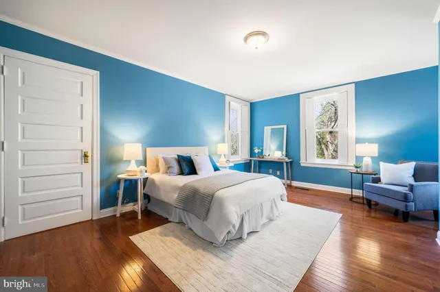 a bedroom with a large bed and a couch