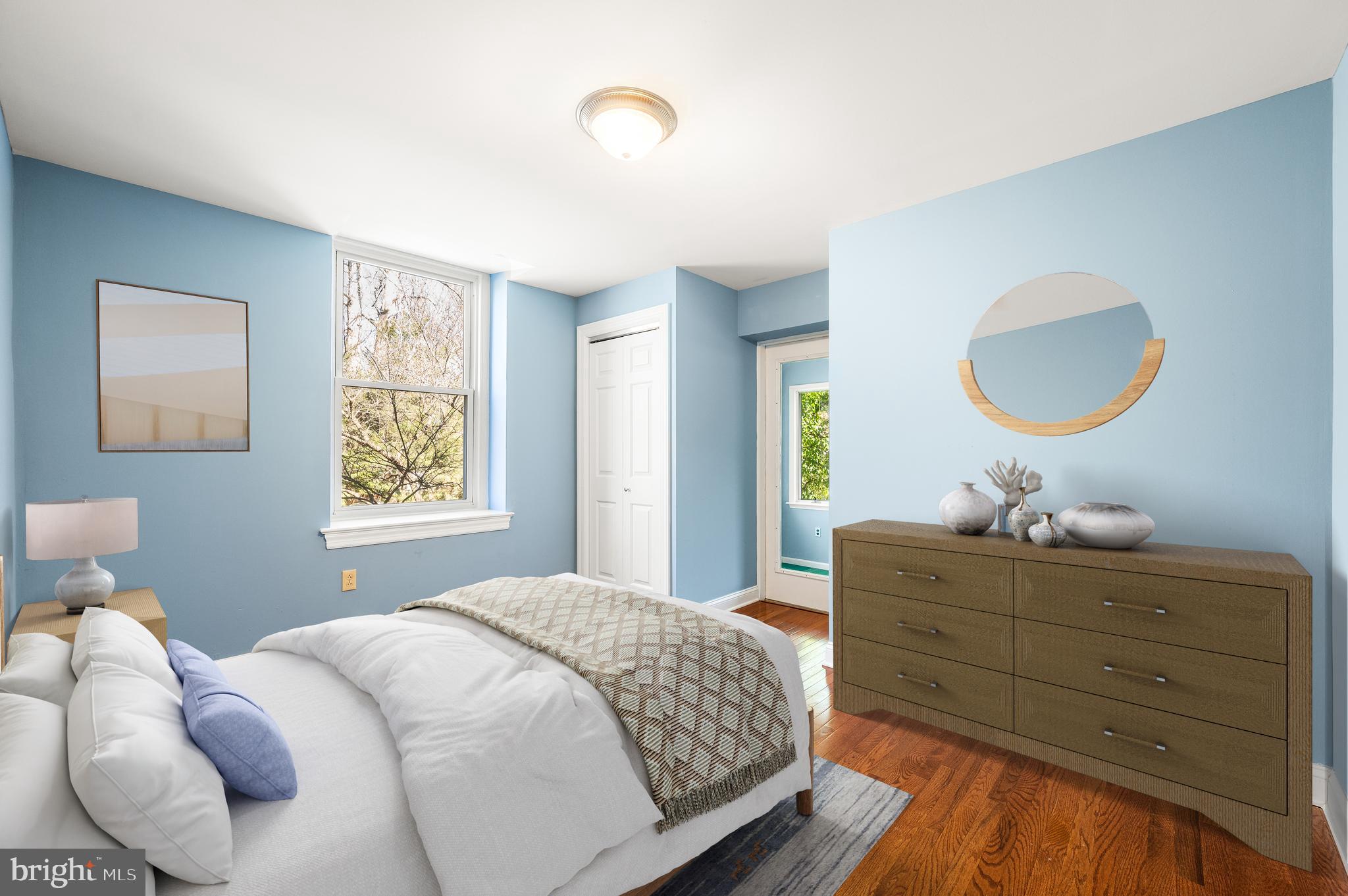 519 Walnut Lane, Unit 1 Swarthmore, PA 19081 - Photo 21 of 31 a bedroom with a bed and a chandelier