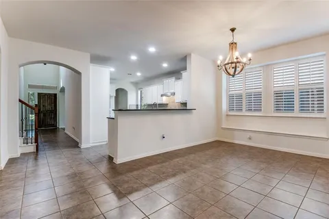 a view of a kitchen with a sink and a window
