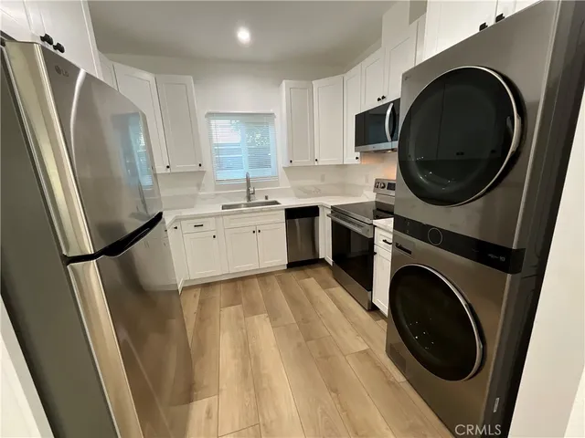 a kitchen with a washer and dryer