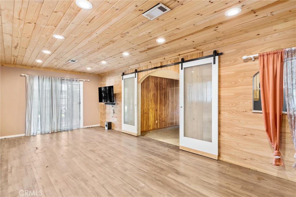 450 West Cromwell Street Rialto, CA 92376 - Photo 16 of 35 Original Image - 2. Bonus room with sliding doors to 4th bedroom and slider to back patio. This room could be used as a family room, craft area or play room. The possibilities are endless.