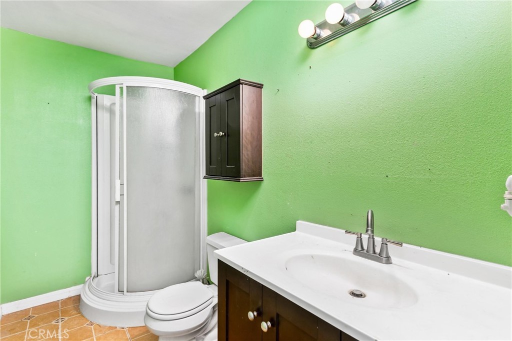 450 West Cromwell Street Rialto, CA 92376 - Photo 19 of 35 Hallway bathroom with single vanity and walk in shower