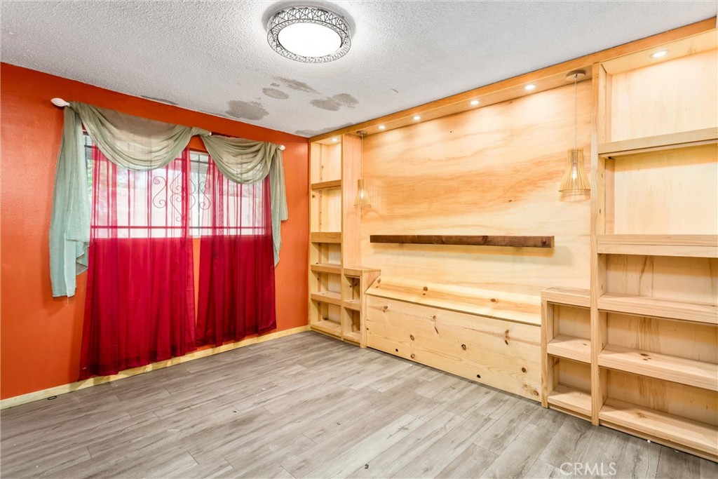 450 West Cromwell Street Rialto, CA 92376 - Photo 24 of 35 Primary Bedroom #3 Original Image - 3. Vinyl flooring, built in shelves/headboard area