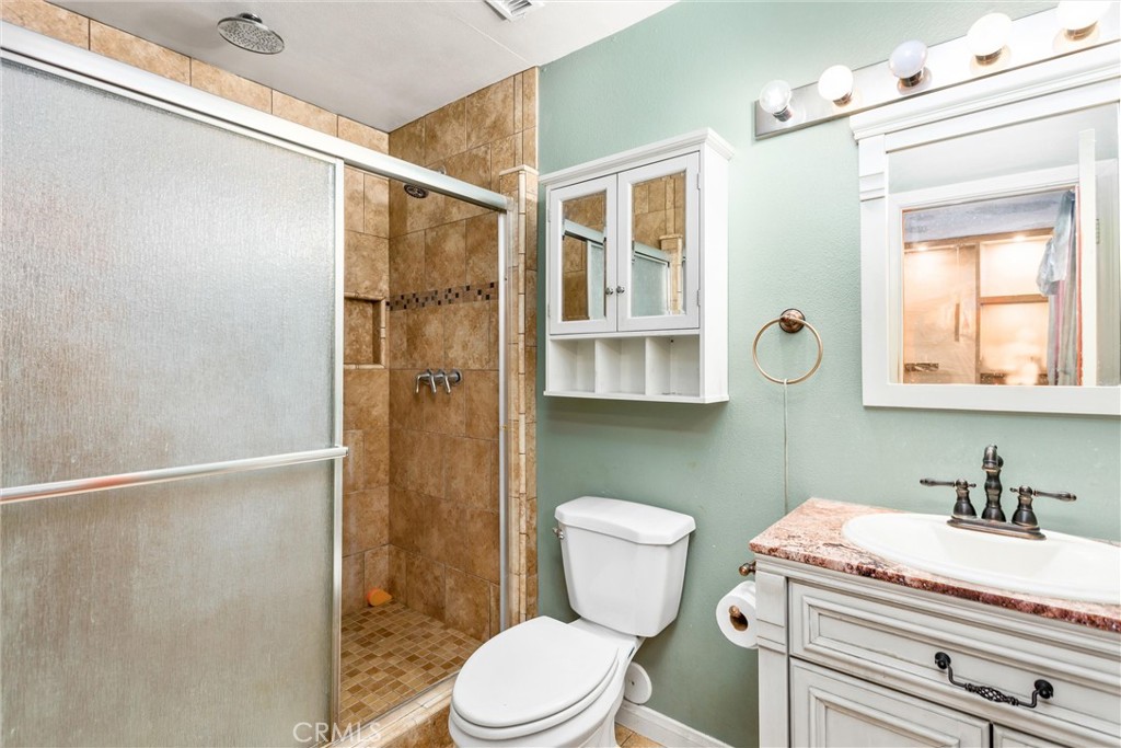 450 West Cromwell Street Rialto, CA 92376 - Photo 27 of 35 Bathroom #2 in Primary Bedroom #3 with walk in shower that is nicely tiled