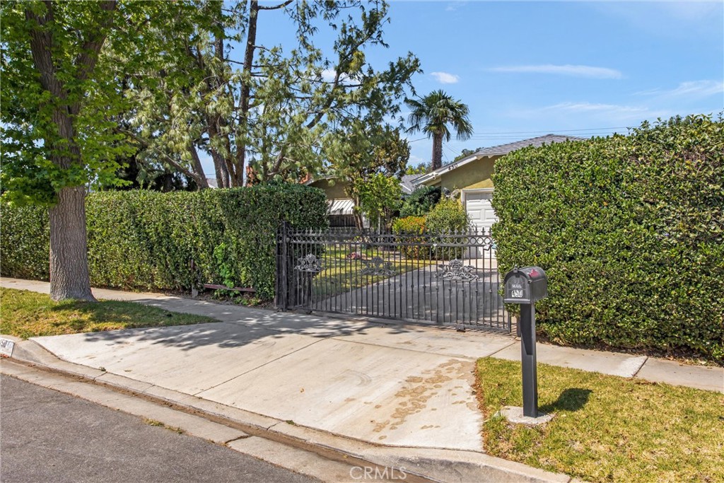 450 West Cromwell Street Rialto, CA 92376 - Photo 3 of 35 Sliding security gate to the yard