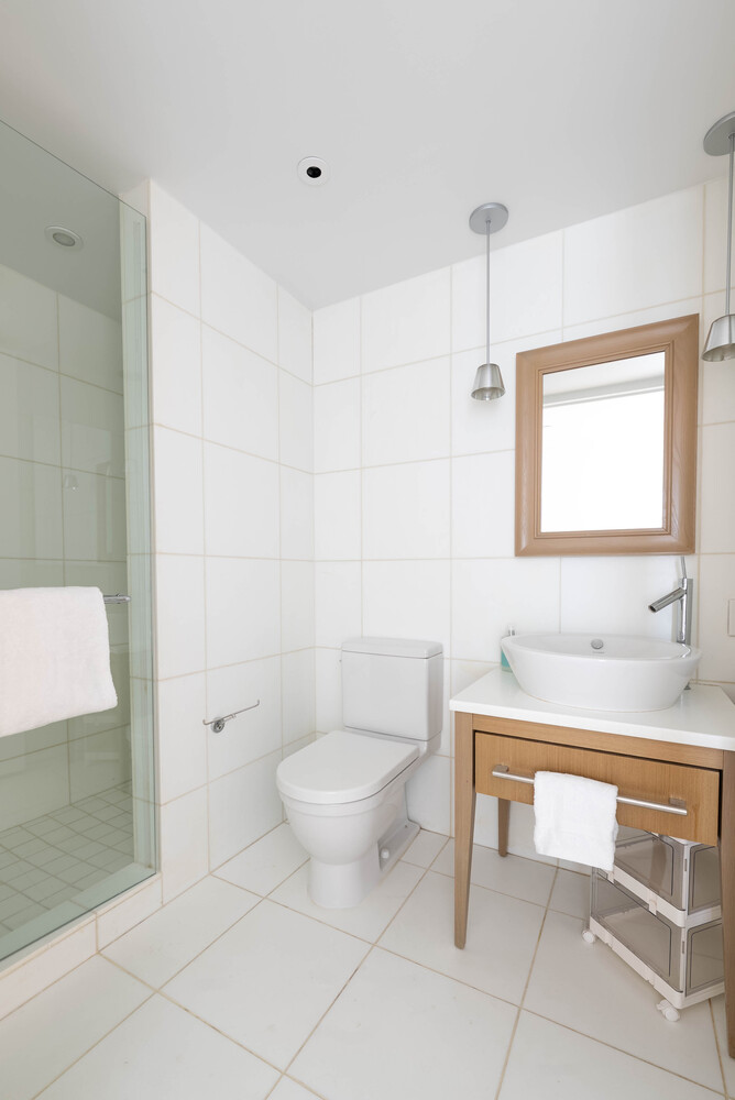 340 East 23rd Street, Unit 5M Manhattan, NY 10010 - Photo 11 of 15 a bathroom with a sink toilet and mirror