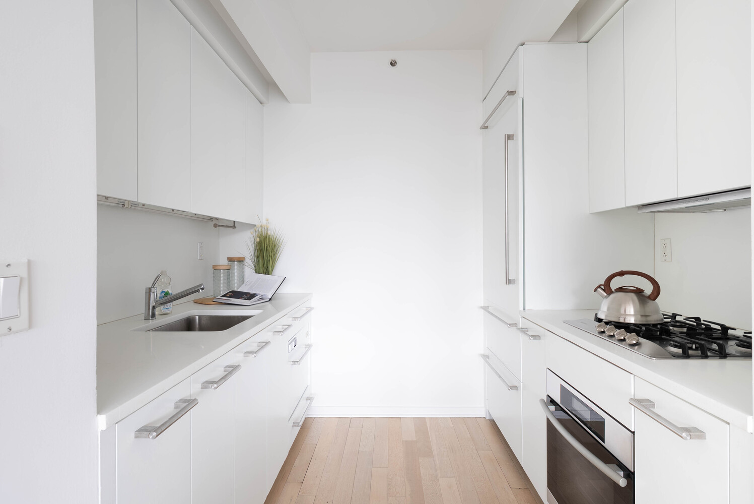 340 East 23rd Street, Unit 5M Manhattan, NY 10010 - Photo 5 of 15 a kitchen with a sink and cabinets