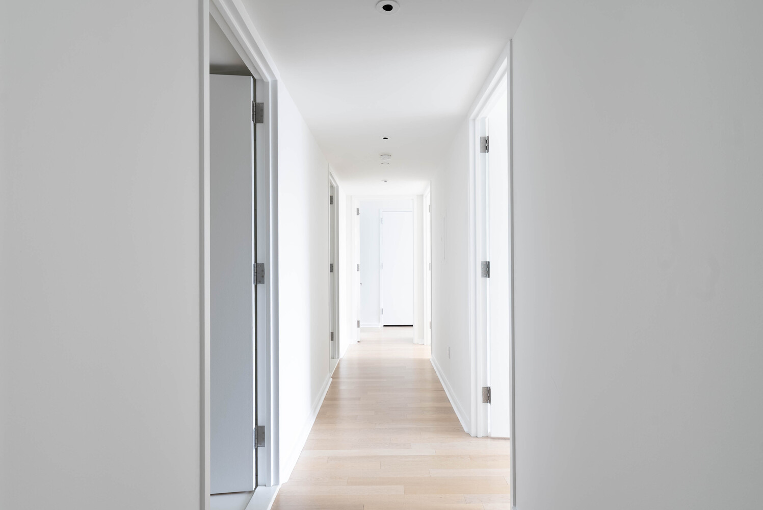 340 East 23rd Street, Unit 5M Manhattan, NY 10010 - Photo 6 of 15 a view of a hallway with wooden floor and closet