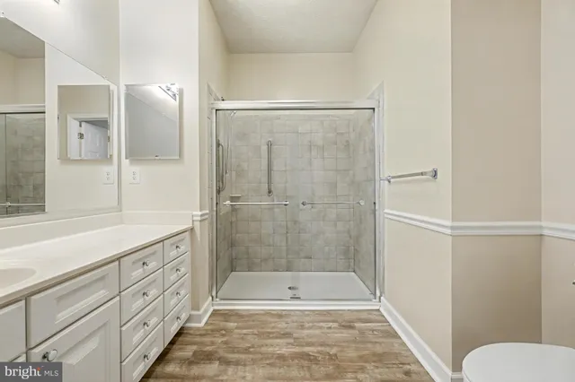 a bathroom with a shower and a toilet
