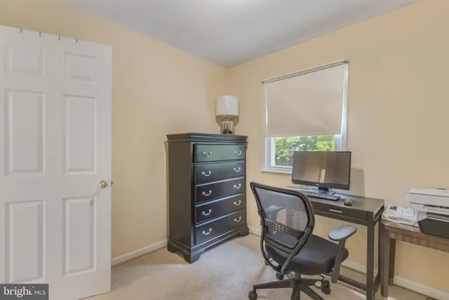 a view of a workspace with furniture