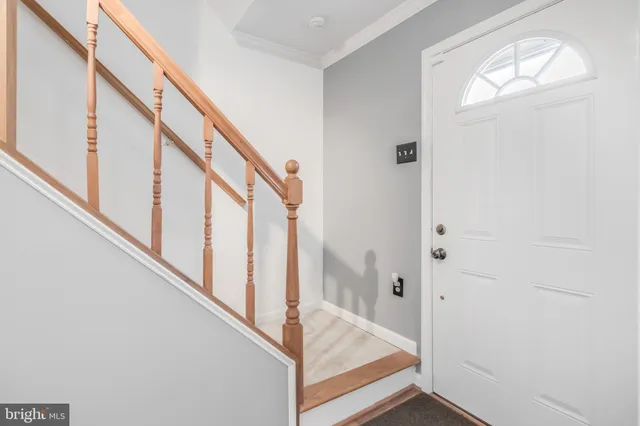 a view of staircase with white walls and stairs