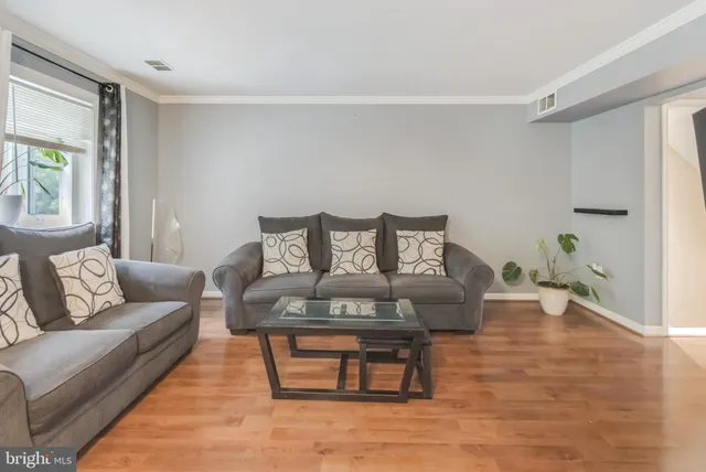 a living room with furniture and a rug