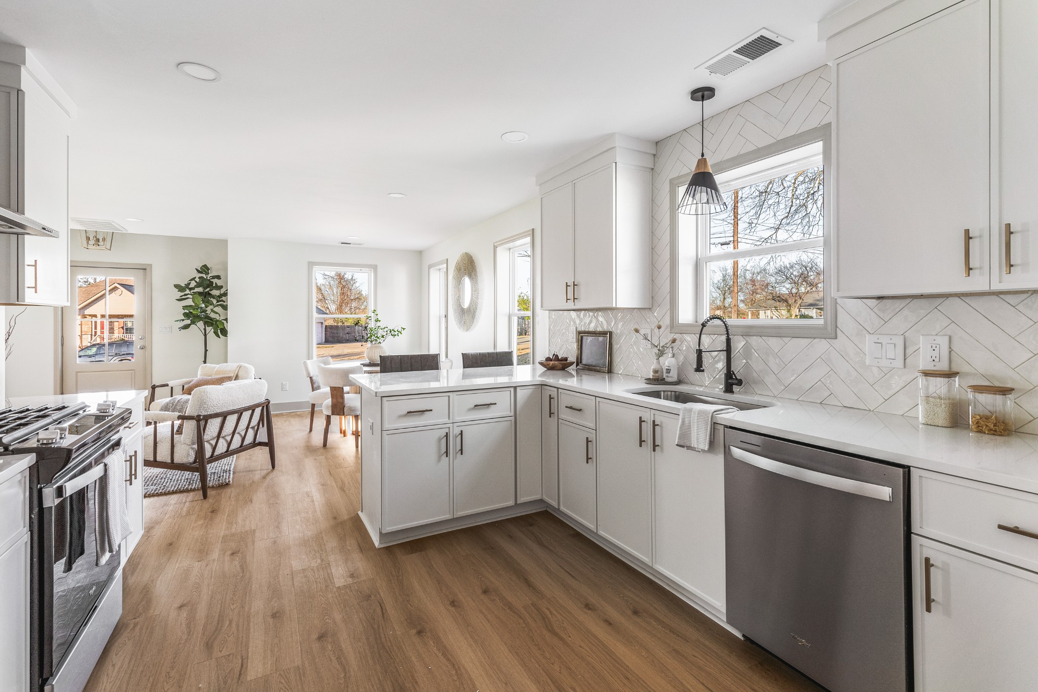 104 Legion Drive Old Hickory, TN 37138 - Photo 11 of 26 a kitchen with sink cabinets and wooden floor