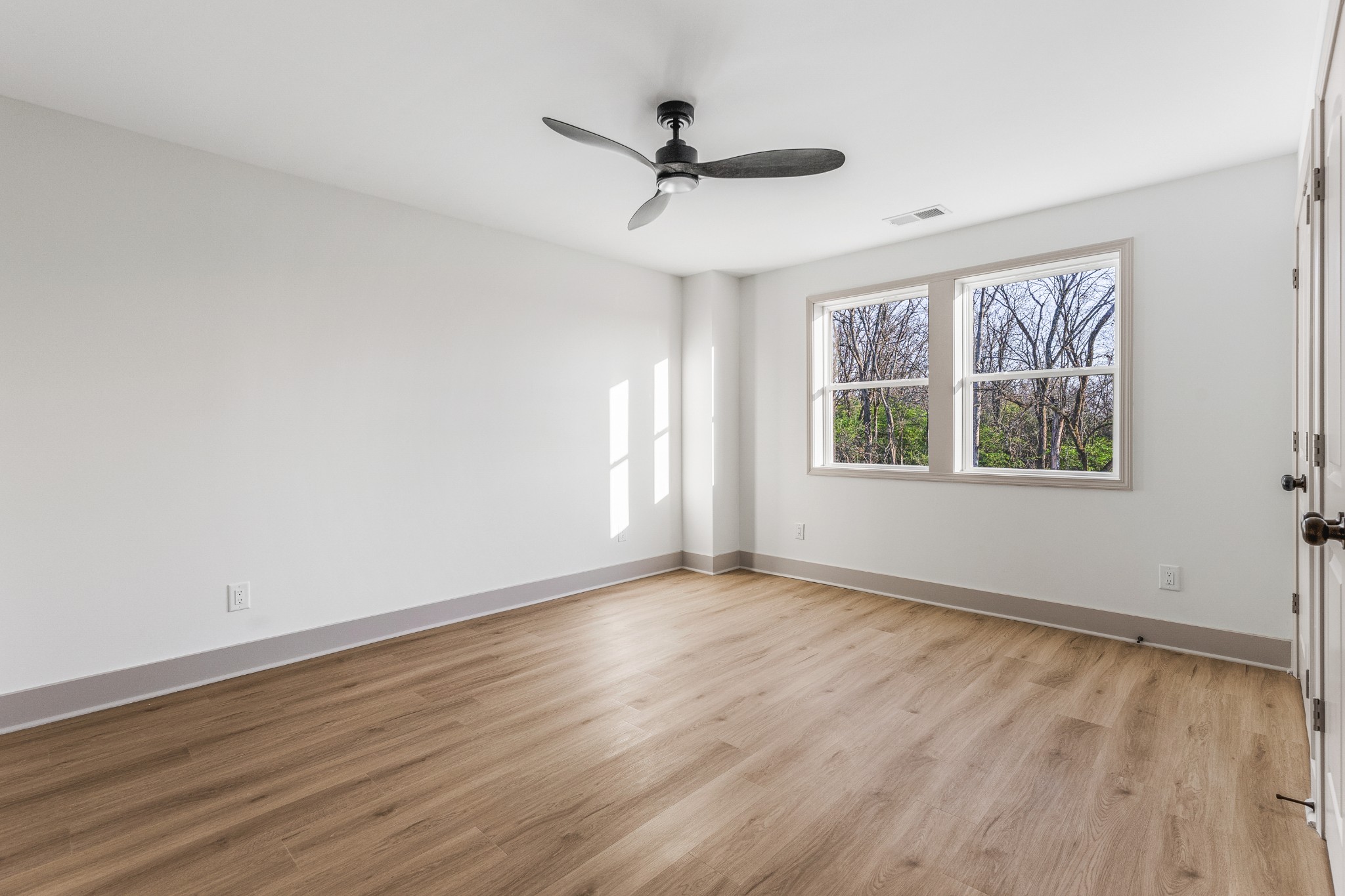 104 Legion Drive Old Hickory, TN 37138 - Photo 20 of 26 a view of an empty room with wooden floor and a window