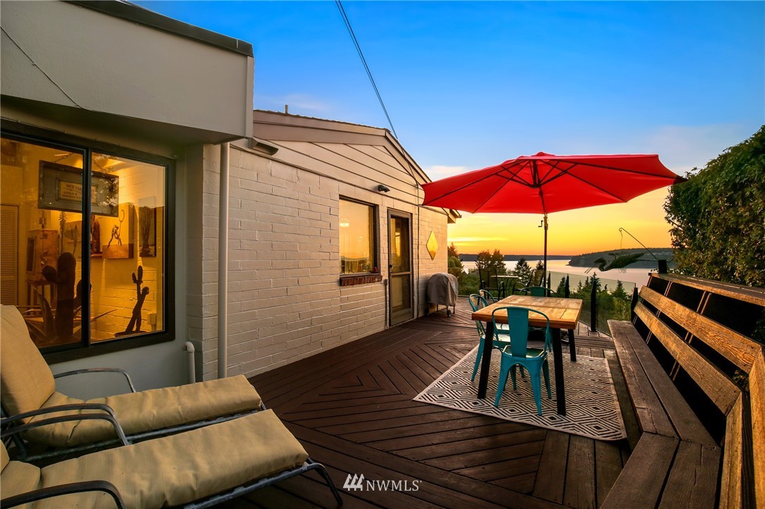 4428 Sunset Beach Road West University Place, WA 98466 - Photo 22 of 25 a view of a outdoor sitting area with furniture and umbrella