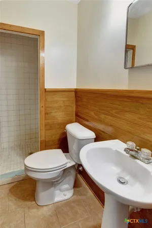 a bathroom with a sink and a toilet