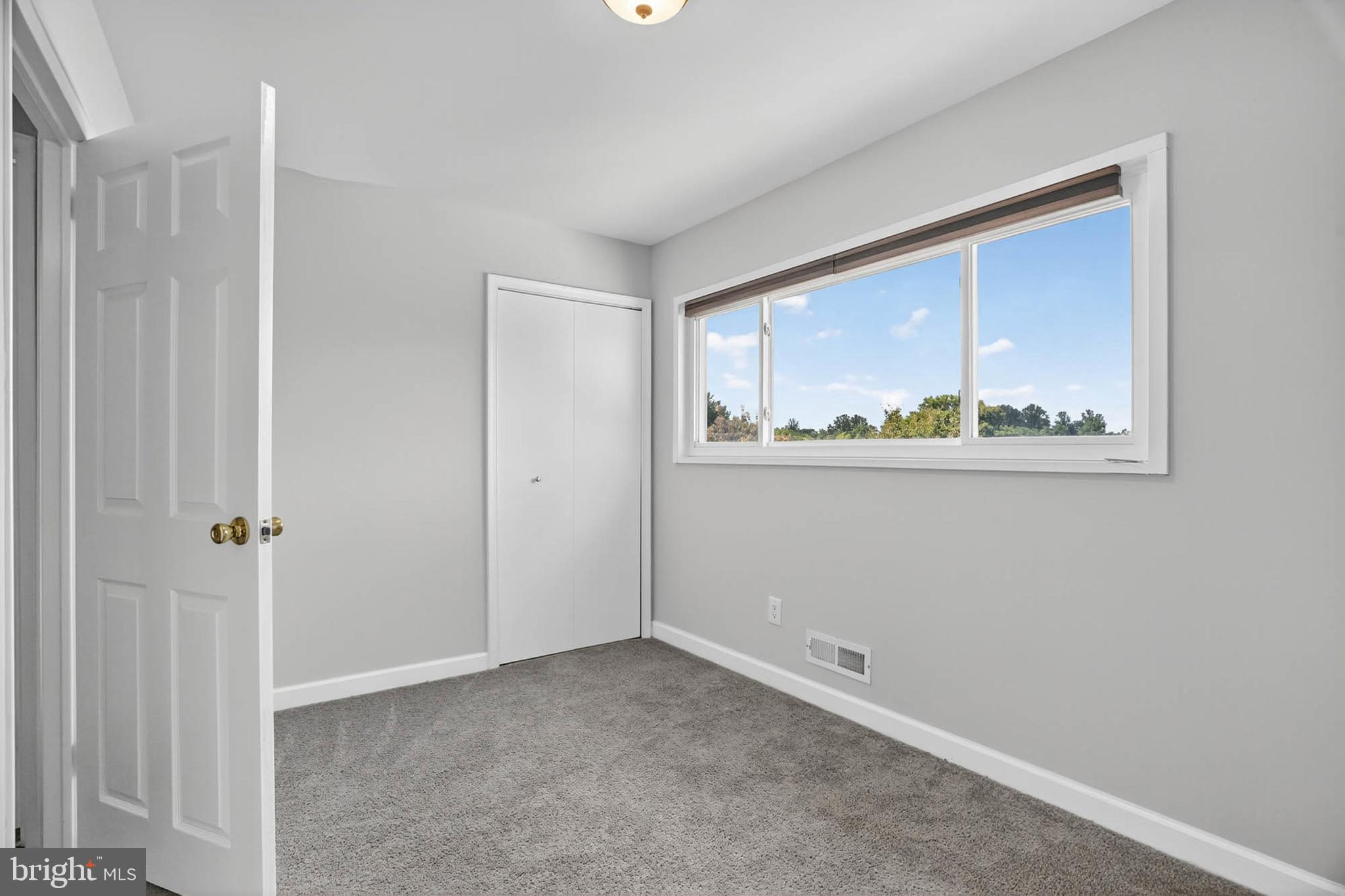 920 Vanderwood Road Catonsville, MD 21228 - Photo 12 of 25 a view of an empty room with a window