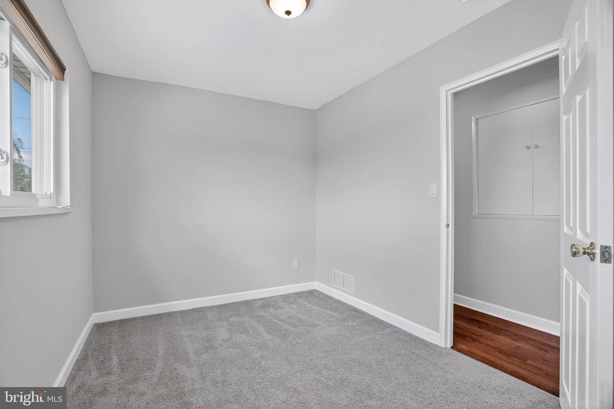 920 Vanderwood Road Catonsville, MD 21228 - Photo 13 of 25 an empty room with windows and closet