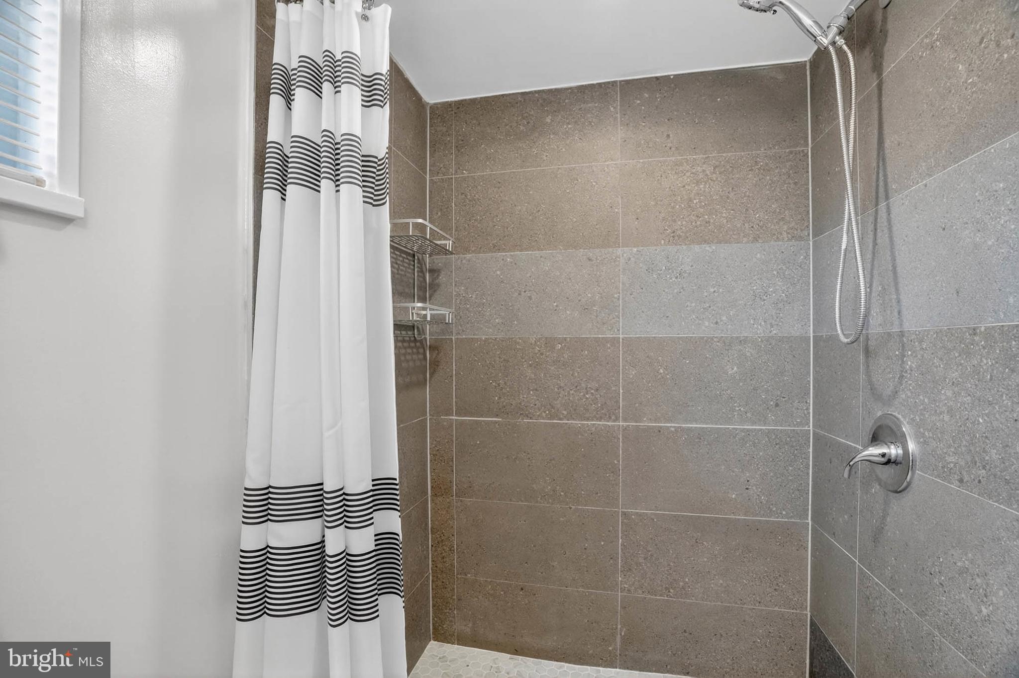 920 Vanderwood Road Catonsville, MD 21228 - Photo 20 of 25 a bathroom with a shower