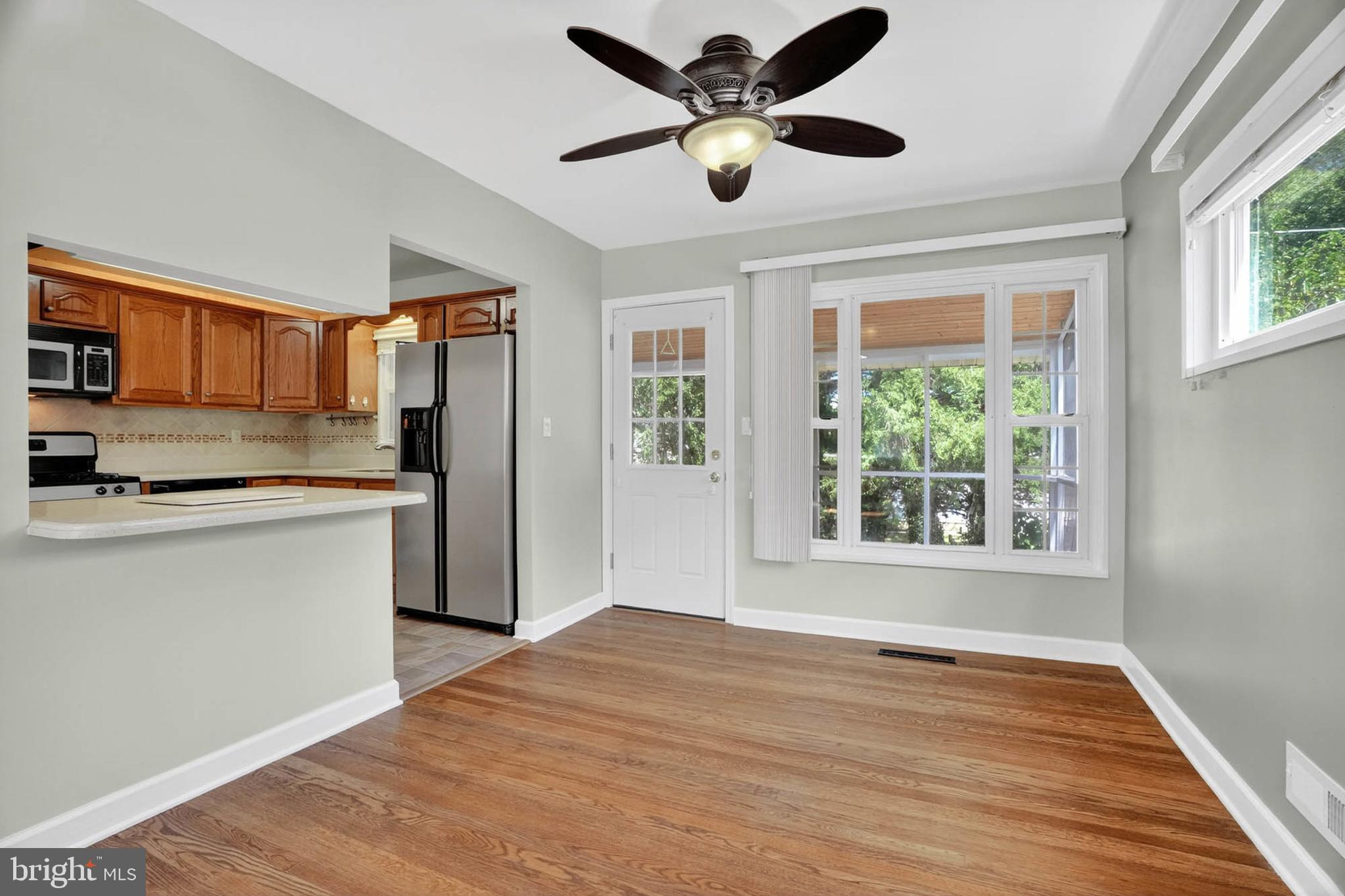 920 Vanderwood Road Catonsville, MD 21228 - Photo 7 of 25 a kitchen with stainless steel appliances granite countertop a refrigerator and a stove top oven
