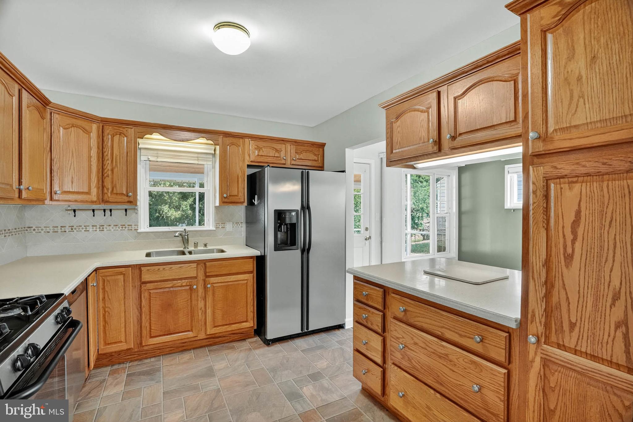 920 Vanderwood Road Catonsville, MD 21228 - Photo 8 of 25 a kitchen with stainless steel appliances granite countertop a refrigerator and a sink