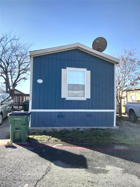 709 North Collins Freeway, Unit 70 Howe, TX 75459 - Photo 1 of 15 a front view of a house with a yard