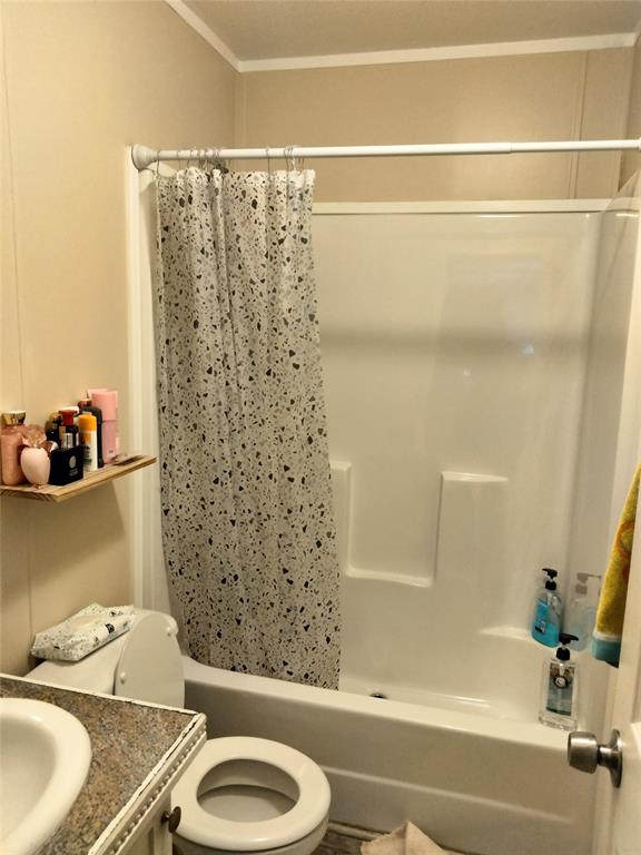 709 North Collins Freeway, Unit 70 Howe, TX 75459 - Photo 12 of 15 a bathroom with a sink a toilet and shower