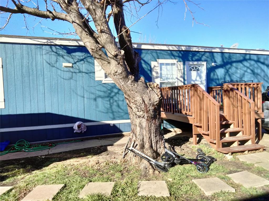 709 North Collins Freeway, Unit 70 Howe, TX 75459 - Photo 8 of 15 a view of a house with a yard