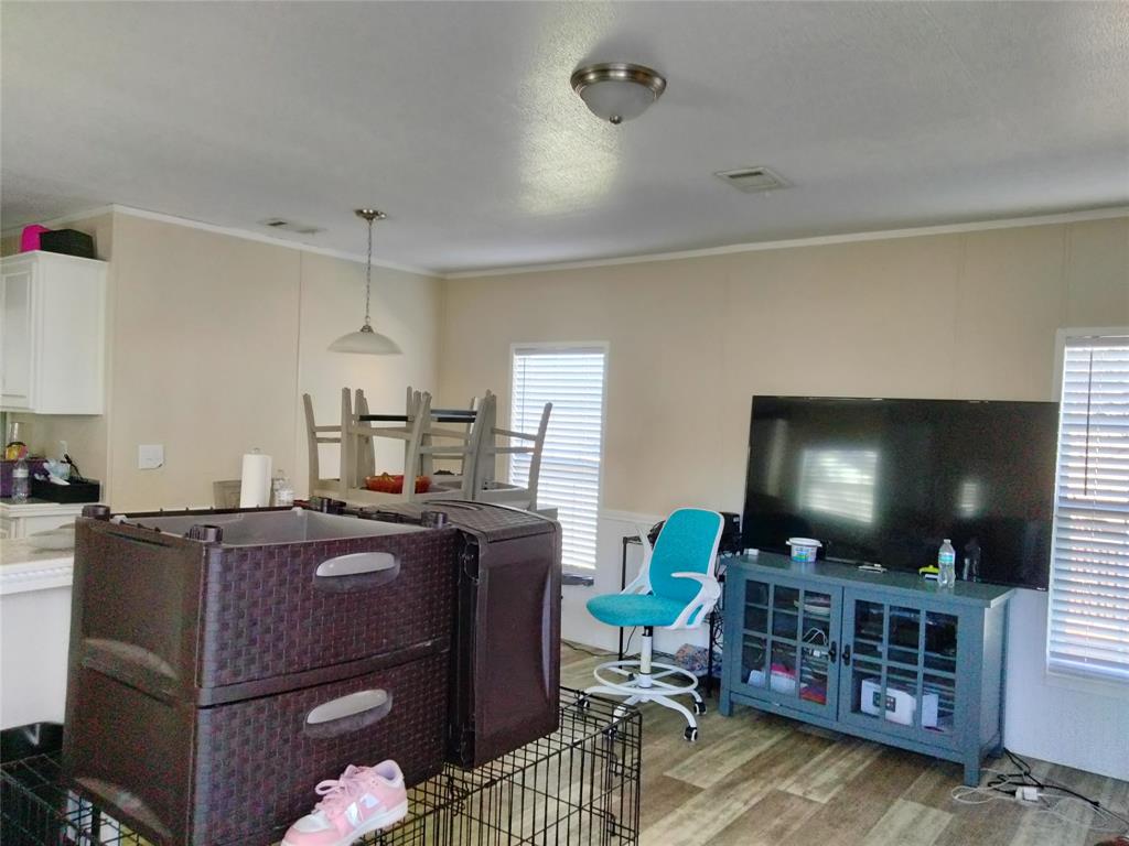 709 North Collins Freeway, Unit 70 Howe, TX 75459 - Photo 10 of 15 a living room with furniture and a flat screen tv
