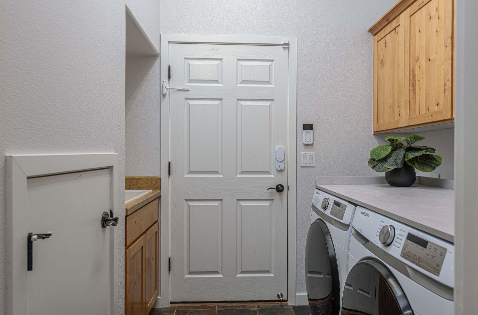 19442 Chip Shot Lane Bend, OR 97702 - Photo 32 of 47 Laundry room with new washer/dryer, utility sink and lots of storage