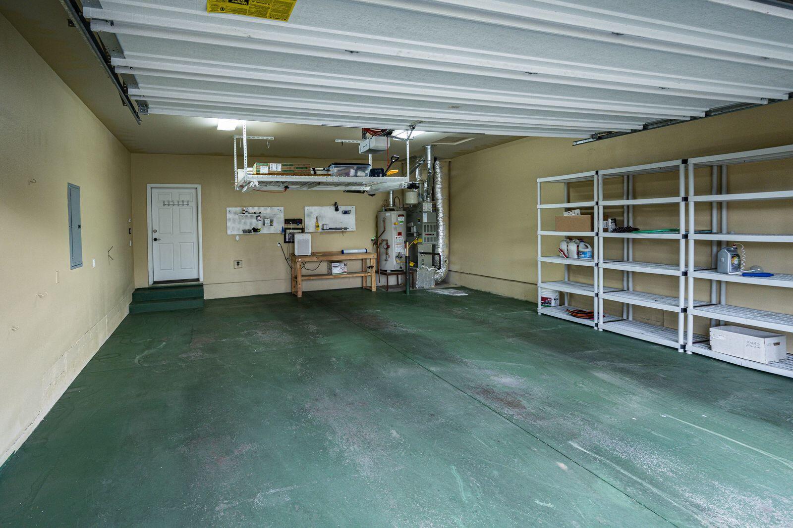 19442 Chip Shot Lane Bend, OR 97702 - Photo 33 of 47 2 car garage with hanging storage rack included in the sale.