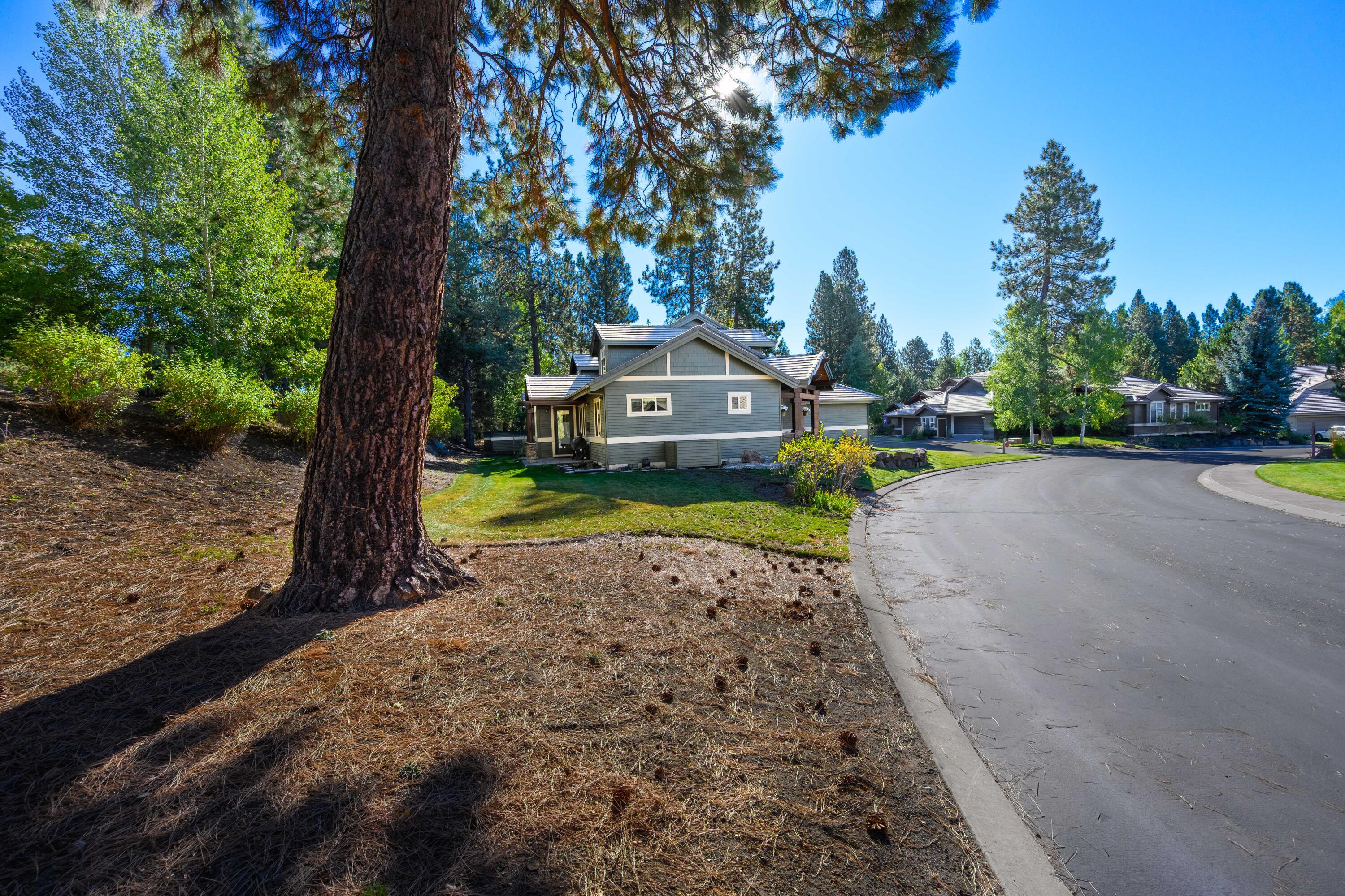 19442 Chip Shot Lane Bend, OR 97702 - Photo 5 of 47 The home sits on a .17/acre lot with nice grassy buffer space around the side and back of the property