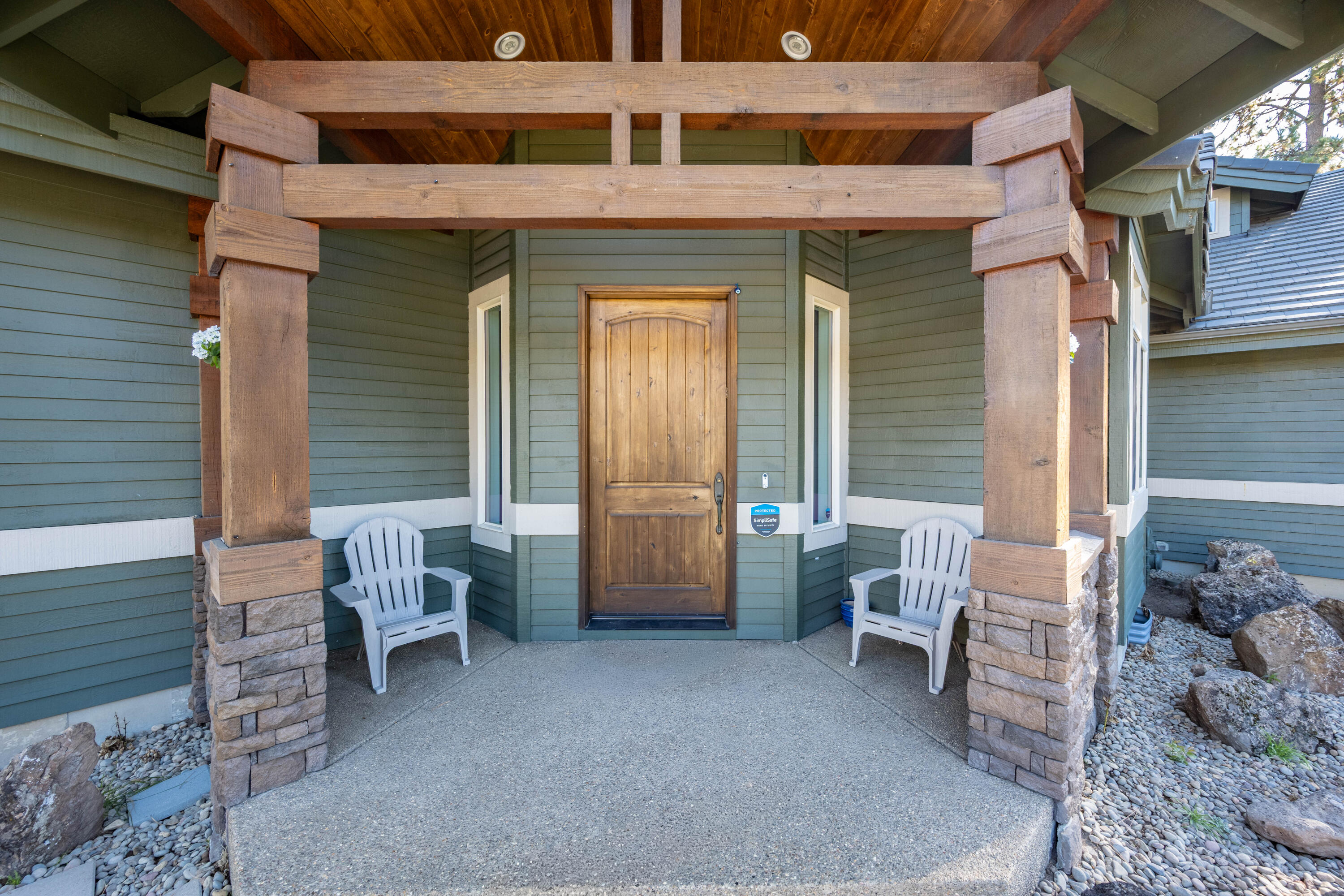 19442 Chip Shot Lane Bend, OR 97702 - Photo 7 of 47 Covered front porch with wood beams and pillars, together with stone accents shows the quality of these well built townhomes
