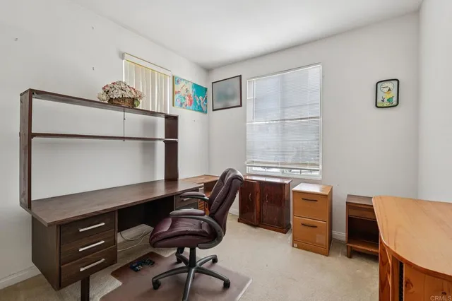 a view of a workspace with furniture