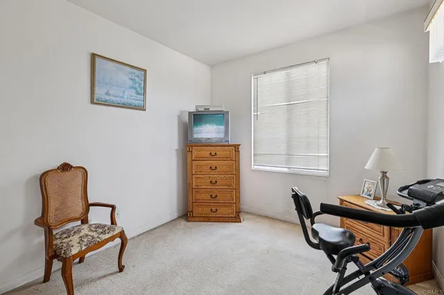 a bathroom with a sink double vanity granite tub shower and a mirror