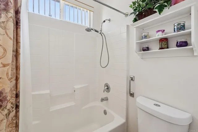 a room with furniture and a flat screen tv