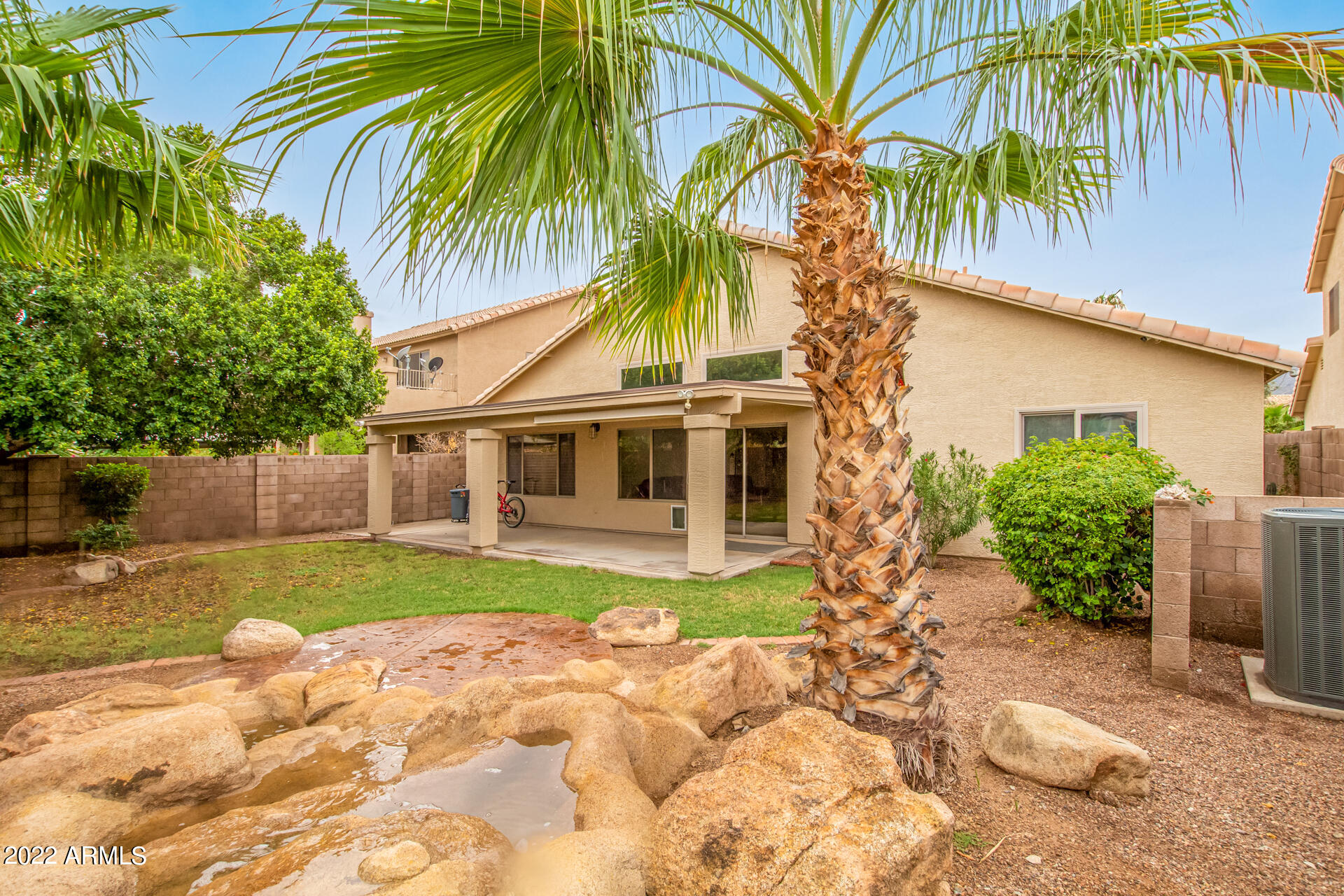 3937 East Agave Road Phoenix, AZ 85044 - Photo 31 of 32 Backyard with water feature