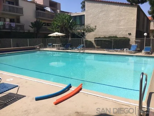 a view of a swimming pool with a lounge chairs