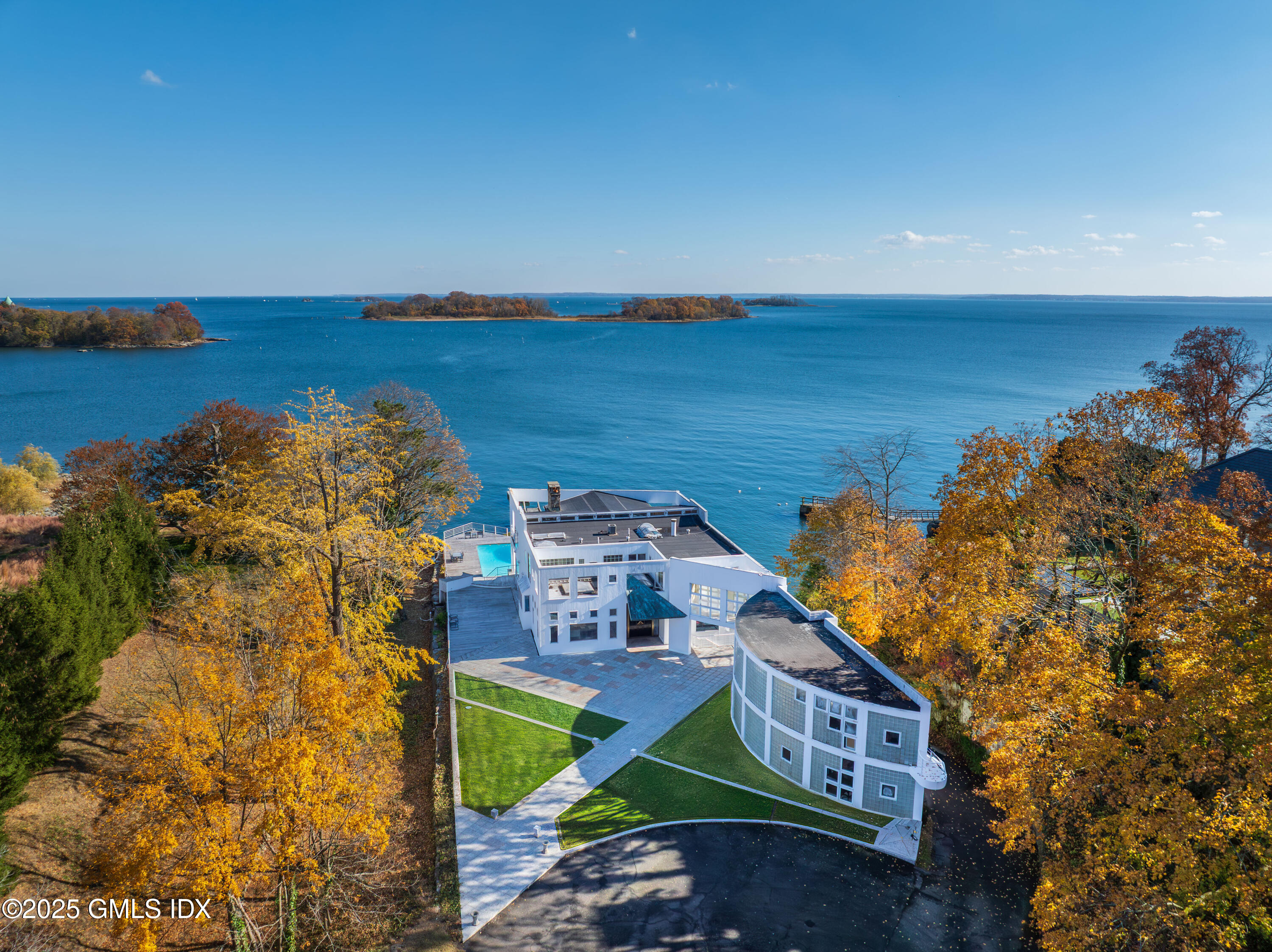 111 Byram Shore Road Greenwich, CT 06830 - Photo 3 of 23 an aerial view of a house with a lake view